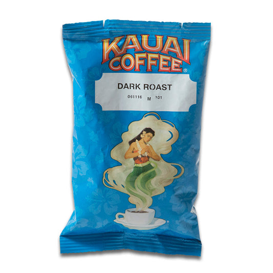 A sealed bag of Kauai Coffee's Dark Roast coffee with a design featuring a woman emerging from a coffee cup amidst swirling steam, set against a blue floral backdrop.