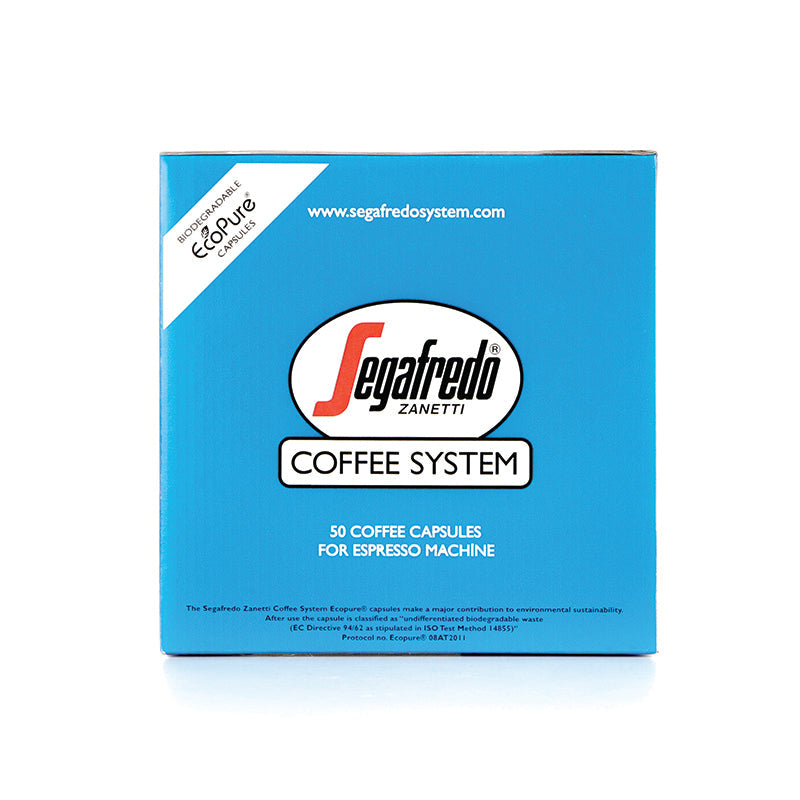 A blue box of Segafredo Zanetti Segafredo Deca Crem (Decaf) Single Serve Espresso Cartridges, containing 50 single serve cartridges for espresso machines. It features a website link and an eco-friendly packaging note, along with Segafredo Espresso's commitment to natural decaffeination.