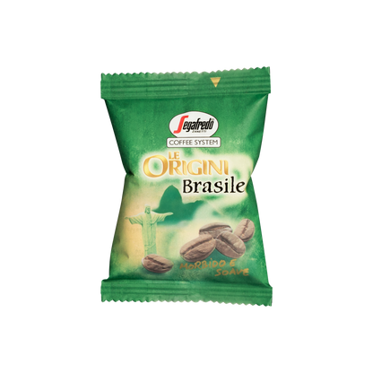A sealed green packet of "Segafredo Zanetti Brazilian Single Origin Espresso Single-Serve Cartridges" featuring an illustration of coffee beans and the Christ the Redeemer statue, sourced from the Nossa Senhora da Guia plantation. Perfect for brewing with your Segafredo Espresso 1 Brewer.