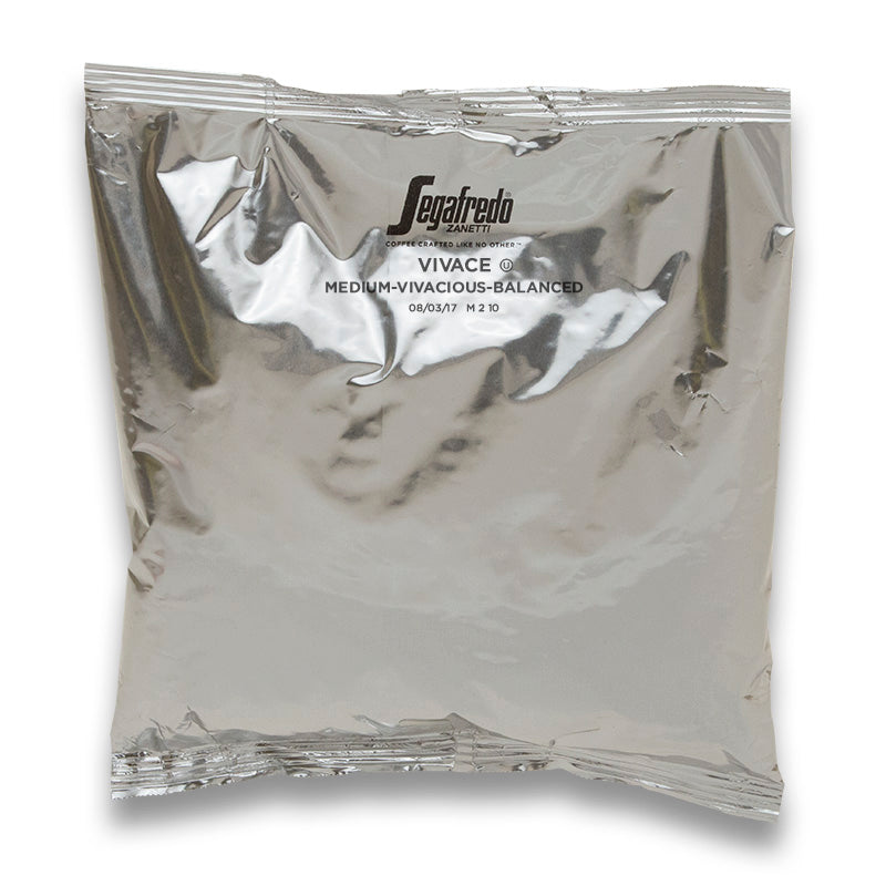 A vacuum-sealed foil package labeled "Segafredo Zanetti, Segafredo Vivace Medium Roast," containing a blend of medium roasted Brazilian and Colombian Arabicas.
