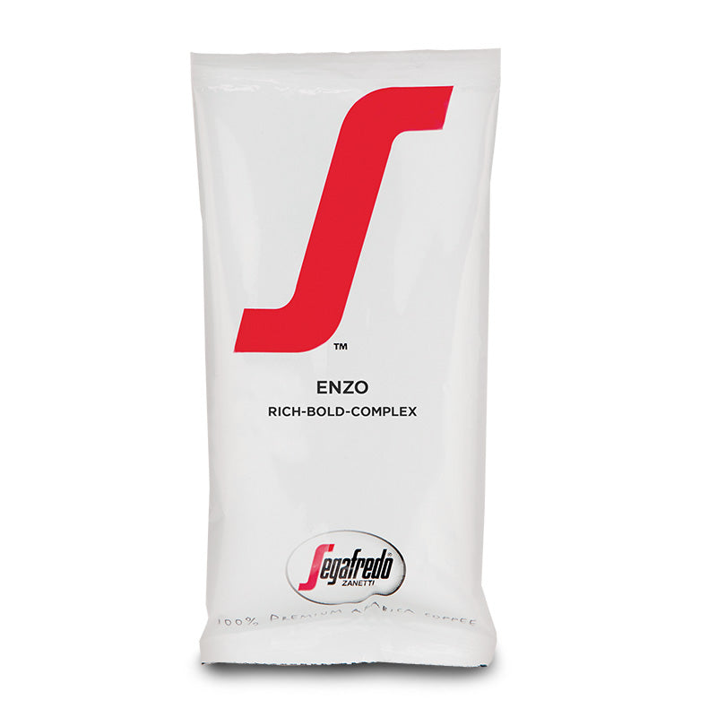 A white package of Segafredo Zanetti Enzo Dark Roast coffee, labeled "rich-bold-complex" with a red stylized "S" logo and dark roasted coffee text.