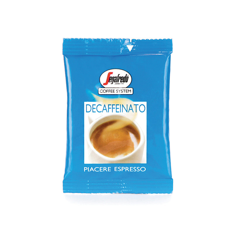 A blue packet of Segafredo Zanetti Segafredo Deca Crem (Decaf) Single Serve Espresso Cartridges labeled "Piacere Espresso" with an image of an espresso cup on the front, featuring a natural decaffeination process.