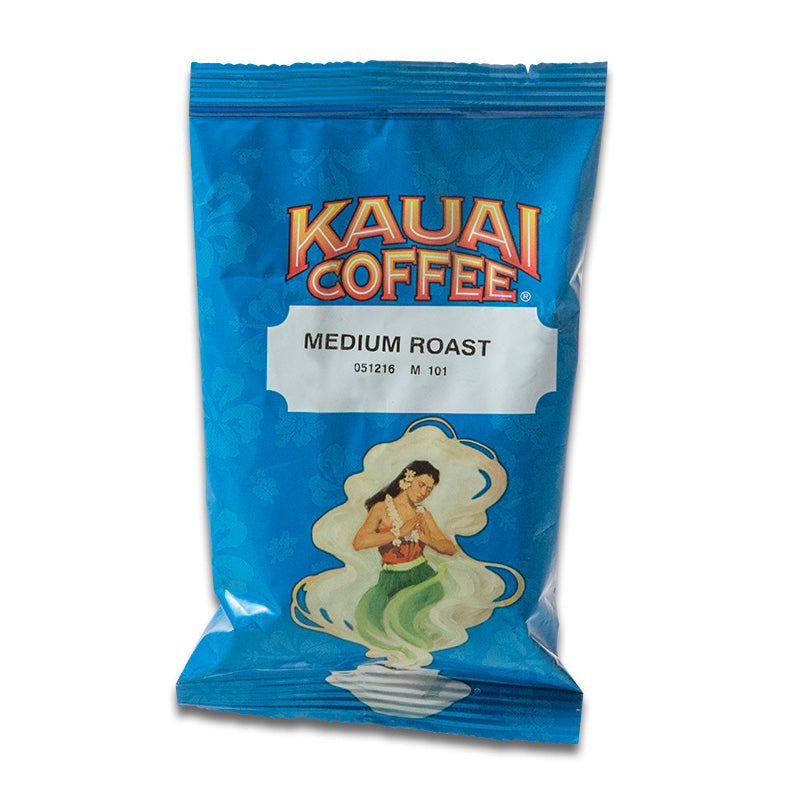 A bag of Kauai Coffee Medium Roast with an illustration of a hula dancer on a blue background.