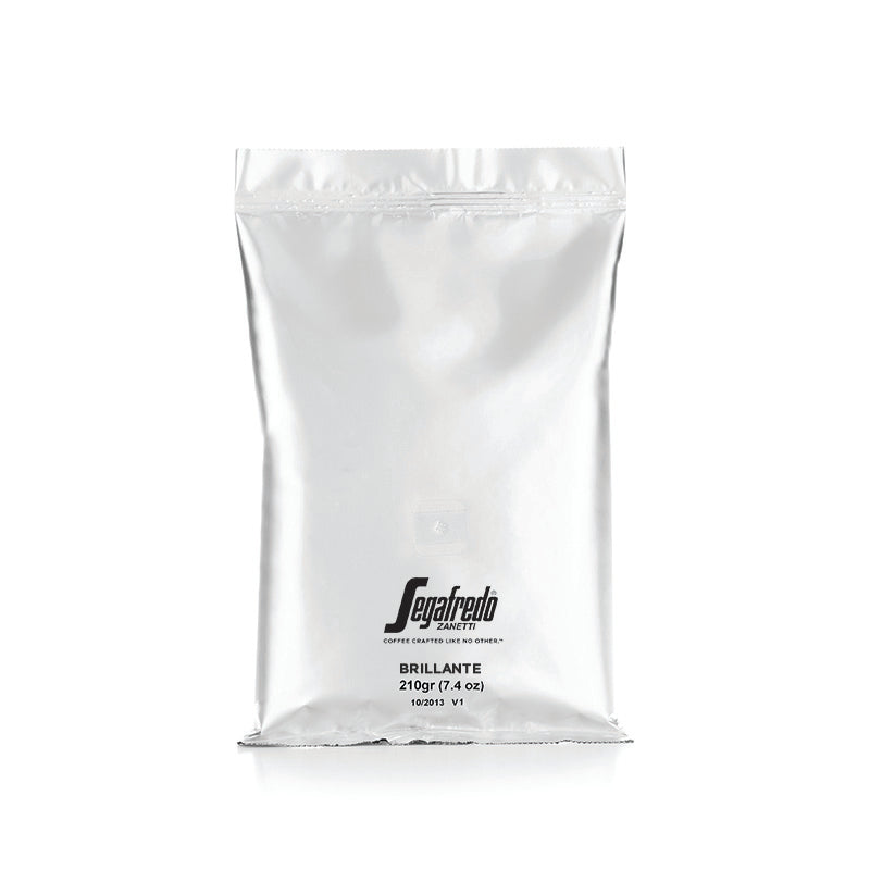 Silver coffee bag with "Segafredo Zanetti" branding and the label "Segafredo Brillante Light Roast, 210g" on a simple, white background.