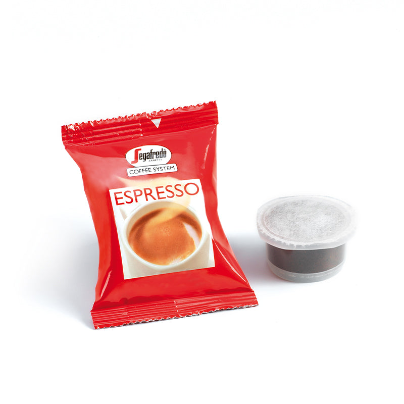 A red Segafredo Zanetti espresso coffee pod package next to a single Segafredo Caffe Espresso cartridge, both on a white background.